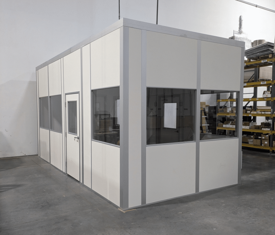 Modular laser engraving machine enclosure by MachineEnclosure.com installed in an industrial facility.