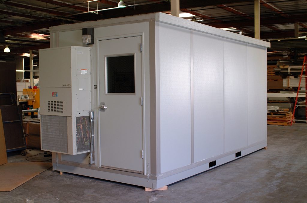 Standalone noise reduction enclosure for machines by MachineEnclosure.com with integrated ventilation system.