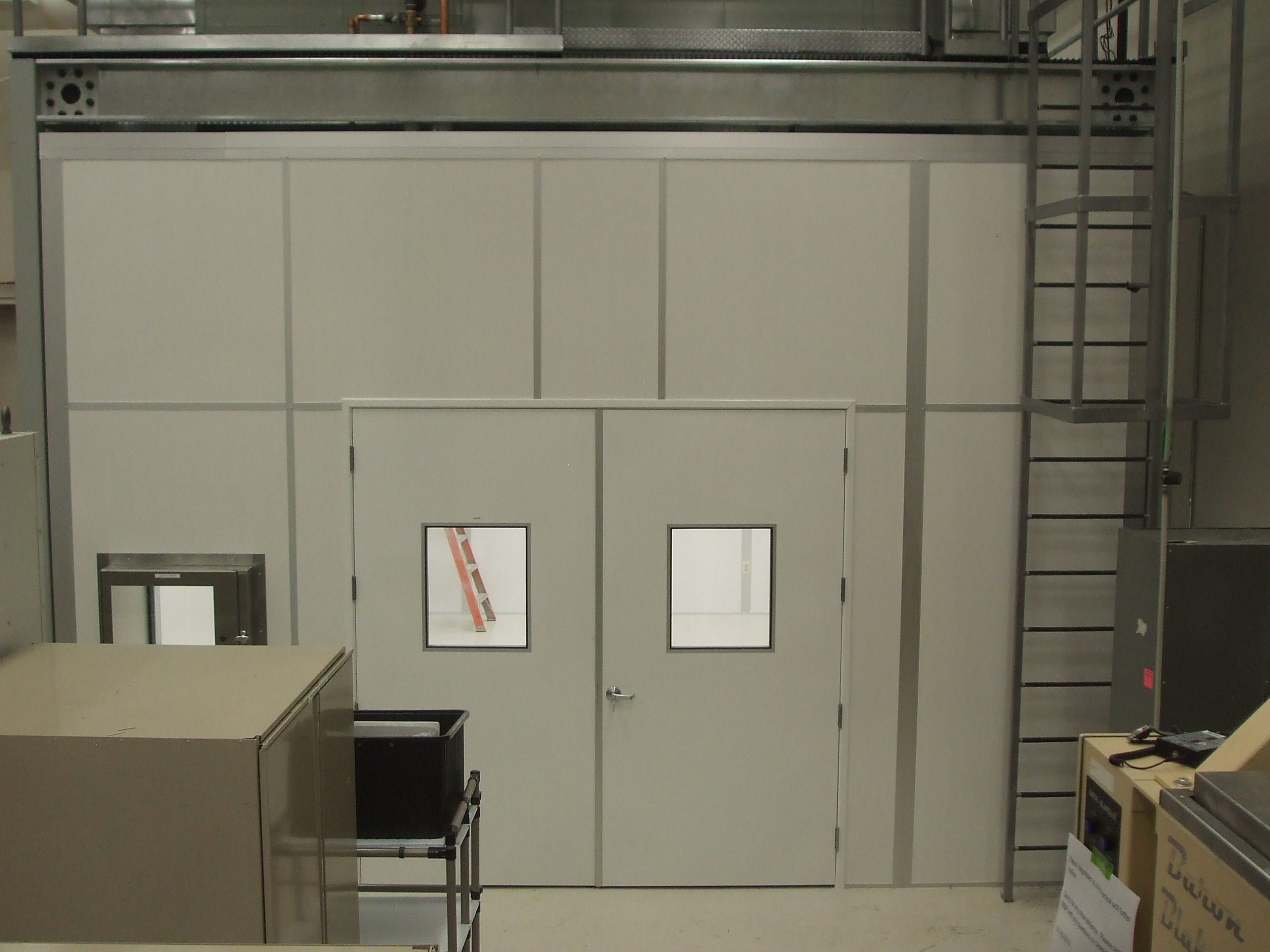 Modular acoustic enclosure with double doors and observation windows by MachineEnclosure.com